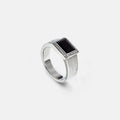 Onyx signet on a grey studio backdrop